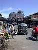 Still a sight of Aberdeen Bazaar. On right-hand side, invisible, the market. In top of the street, Tower Clock.